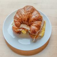 Afternoon Breakfast Sandwich · Fried egg and caramelized onion with your choice of cheese on bagel or croissant.