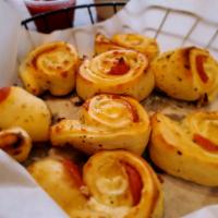 Pepperoni Bites · Fresh hand-tossed dough topped with pepperoni slices, whole milk mozzarella and Monterey Jac...