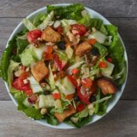 Tropical Salad · Romaine and iceberg greens, cucumbers, plum tomatoes, dried fruit mix, mixed nuts, mango pop...
