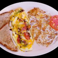 Ranchero Omelette Breakfast · Cheese, onions, bell pepper and tomatoes topped with ranchero sauce.
Served with hash brown ...
