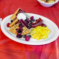 Waffles Breakfast · Served with 1 meat, choice eggs, and side dish.