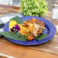 Bob's 420 Chicken · Jamaican jerk chicken with habanero pineapple relish, Caribbean rice and island beans wrappe...