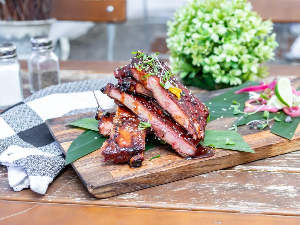 Full Slab Sticky Sweet Ribs · Smoked St. Louis ribs glazed with a sweet Asian sauce served with sesame seeds, scallions and coconut rice. 