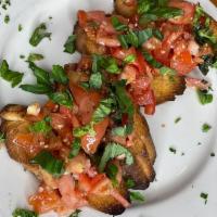 Bruschetta · Bread with tomatoes, basil, and olive oil. 