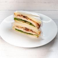 Club Sandwich · Turkey, bacon, lettuce, and tomatoes with mayo.