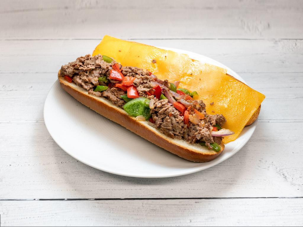 Philly Cheesesteak · Grilled beef, melted American cheese, sauteed onions, bell peppers with gravy or ketchup on a hero.