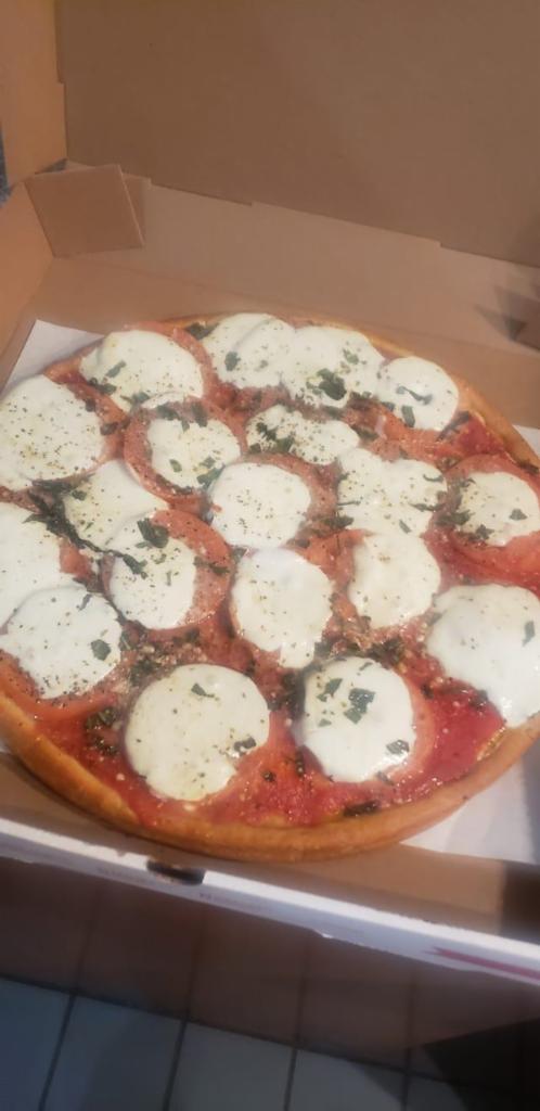 Margherita Pan Pizza · Pan style pizza with fresh mozzarella cheese, fresh basil, and homemade tomato sauce.