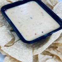 Chips and Queso · Try our delicious queso dip with chips.