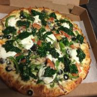 White Veggie Pizza · Cheese, olive oil, ricotta, mushrooms, spinach, tomatoes, green peppers, onions, broccoli an...