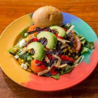 Chicken and Avocado Salad · Romaine lettuce, roasted chicken, tomato, Mexican corn mix, feta cheese, avocado and tortill...