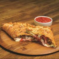 All Meat Calzone 	 · Stuffed with pepperoni, ham, Italian sausage, bacon and our signature three cheeses; served ...