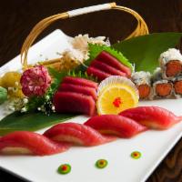 Tuna Lover · 4 pieces of sushi, six pieces of sashimi and one spicy tuna roll. Served with soup or salad.