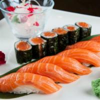 Salmon Sushi Entree · 7 piece sushi and one salmon roll. Comes with soup or salad.