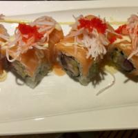 Yummy Roll · Tuna, yellowtail and mango topped salmon, crabmeat and fish roe with honey wasabi sauce. 