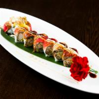 Spider King Roll · Soft shell crab tempura, mango, basil leaf, cucumber, pepper tuna and eel with special sauce. 