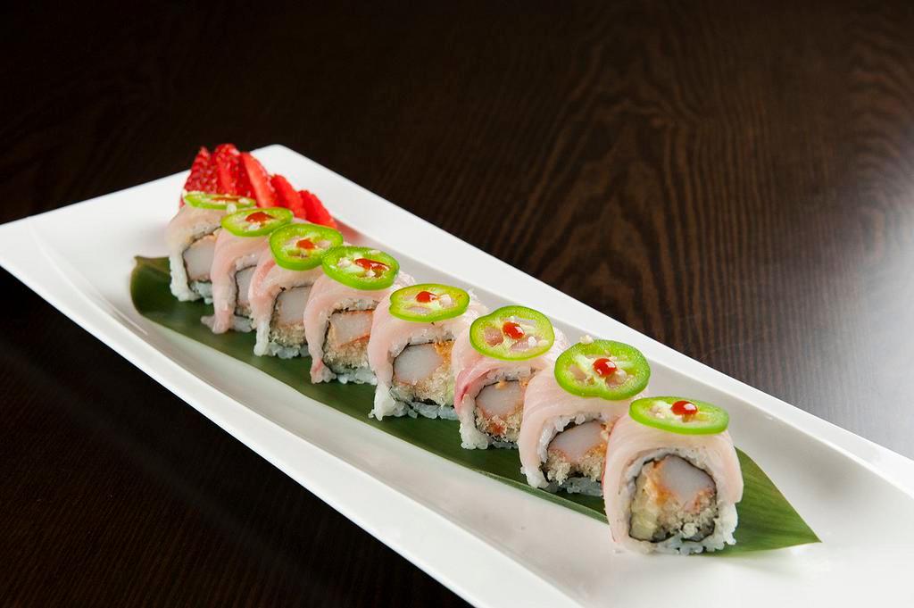 Amazing Yellowtail Roll · Spicy Crabmeat, cucumber and Crunch, masago, topped with yellowtail, jalapeno and chili sauce.