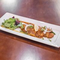 Chili and Gariic Shrimp · Jumbo shrimp sautéed in exotic spices and a garlic sauce.