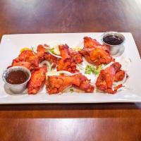 Chicken Wings · Jumbo chicken wings marinated in our house tandoori marinate. Served fried or baked in the t...