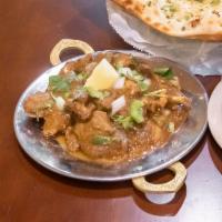 House Curry · A traditional curry. Your choice of meat cooked with onions, tomato, ginger, garlic, coconut...