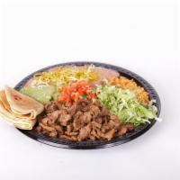 #11. Asada Plate Combination · Steak meat, pico de gallo, guacamole and lettuce. Rice and beans with cheese on the side. Co...