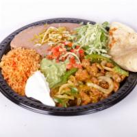 #16. Fajitas Plate Combo · Your choice of chicken or steak fajitas cooked with bell pepper and onion. Comes with lettuc...
