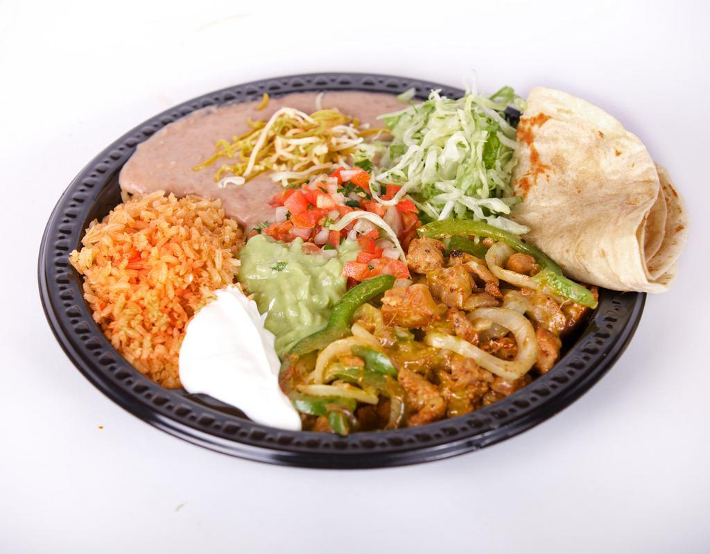 #16. Fajitas Plate Combination · Your choice of chicken or steak fajitas with bell pepper and onion, lettuce, pico de gallo, guacamole and sour cream. Rice and beans with cheese on the side. Comes with tortillas.