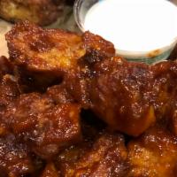 Cauliflower Bites · Battered cauliflower bites (contains eggs) tossed in Chipotle BBQ sauce with a side of ranch