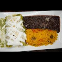 Shrimp Enchiladas · Corn tortilla, shrimp with poblano pepper cream sauce and melted cheese. Yellow rice and bea...