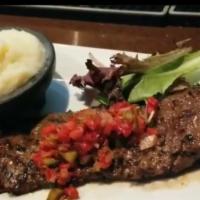 Churrasco Steak · Grilled skirt steak and Southwestern chimichurri.