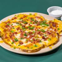Irish Medallions · Potato rounds with jack and cheddar cheese, bacon chips and scallions.
