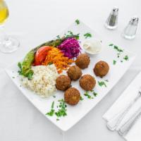 Falafel Dinner · 6 pieces. Pieces of falafel served with hummus with white rice.