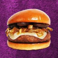 The Mushroom Lover Burger · Beef patty with roasted mushrooms, caramelized onions, melted swiss cheese, and mayo on a fl...