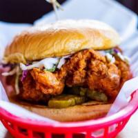 The O.G. Chicken Sandwich · All Natural Chicken Breast topped with Coleslaw, Bread-N-Butter Pickles, and Duke's Mayo