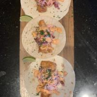 California fish tacos · Mahi Mahi breaded and fried to perfection served with our Chipotle mayo sauce. Served with o...