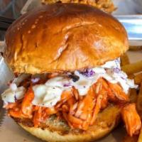 Shredded Bird Sandwich · Hand pulled chicken cooked in our signature BBQ sauce  on toasted bun with coleslaw and pick...