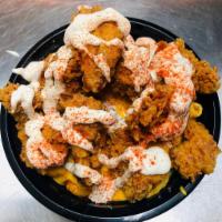 Mac-N-Chicken Bowl · Bed of our homemade mac and cheese topped with our hand battered fried chicken breast and si...