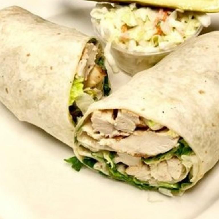Grilled Chicken Caesar Wrap · Grilled chicken served over lettuce, tomato, onions, croutons and Caesar dressing.
