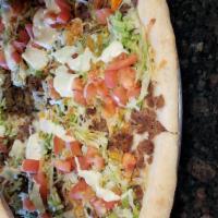 Taco Pizza · Mozzarella cheese, Steak, Lettuce, Tomatoes, Bleu Cheese & Hot Sauce. Hand tossed brick oven...