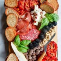 Charcuterie Board for 2 · Hand-crafted board featuring assorted cold meats, cheese, nuts, fruit, jam and bread.
