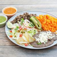 Carne Asada Plate ·  Includes rice, pinto beans, grilled onions, chile toriado, and tortillas.