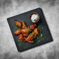 Classic Chicken Wings · Classic chicken wings with a choice of wing sauce and come with your choice of dipping sauce.
