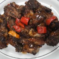 Jamaican Jerk Wings · Wings Seasoned with Ginger,Garlic,Thyme,  Black Pepper Jerk seasoning and family secret sauce.