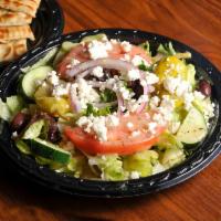 Grecian Salad · Lettuce, tomatoes, onions, cucumbers, Kalamata olives, pepperoncini and feta. Served with gr...