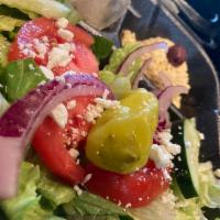 Mini Greek Salad · Lettuce, tomatoes, onions, cucumbers, olives, peppers and feta.
