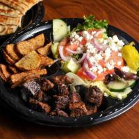 Steak Plate · Grilled sirloin steak medallions served with salad, potatoes and grilled pita bread.