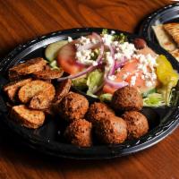 Falafel Plate · Fried falafel nuggets, lettuce and tomatoes served with salad, potatoes and grilled pita bre...