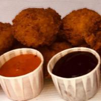 Boneless Wings · All white chicken, lightly breaded and baked golden. Choose your favorite sauce to dip them ...