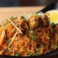 Lamb Biryani · Boneless Lamb Cooked With Saffron flavor Basmati Rice in herbs And Spices, And Topped With N...