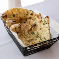 Garlic Naan · White flour bread stuffed with chopped garlic, baked in tandoor oven.