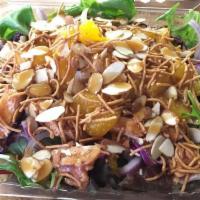 Asian Sesame Salad · Mix greens, red cabbage, edamame, mandarins, jicama, red onions, dry noodles, almonds, grill...